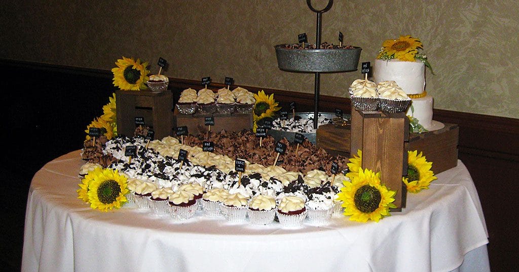 Wedding reception cupcake table with sunflowers on 8/3/19.