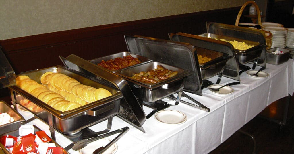 Sunday Breakfast Buffet Foods including pancakes, sausage links, bacon, eggs and more!
