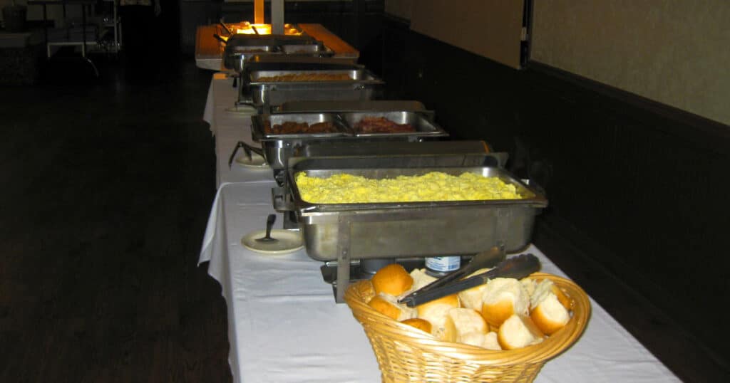 Sunday Breakfast Buffet Foods including rolls, eggs, sausage links pancakes and more hot foods!