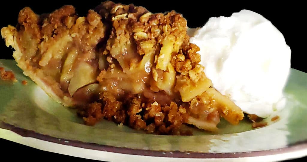 Apple pie slice with vanilla ice cream.