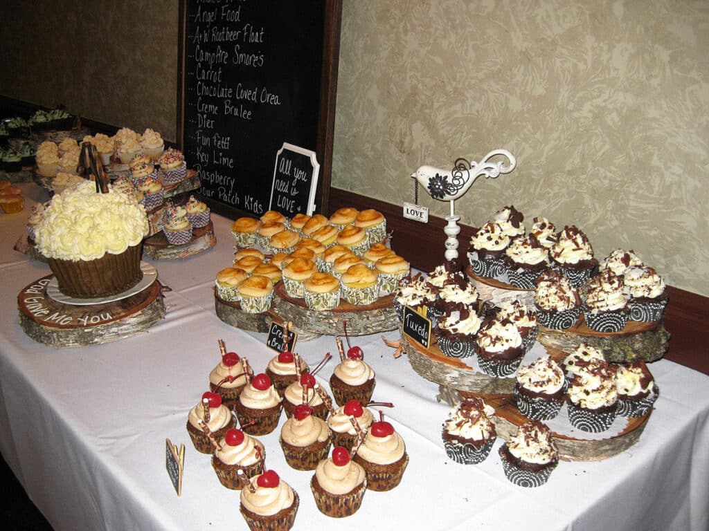 Cupcakes for wedding reception on table.